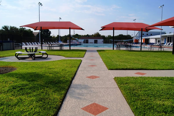 Recreation Center - Pool Patio with Shaded Tables and Lounge Chairs